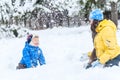 Outdoor portrait Mother and child playing in the winter park. sh Royalty Free Stock Photo