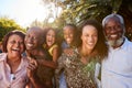 Outdoor Portrait Of Multi-Generation Family In Garden At Home Against Flaring Sun Royalty Free Stock Photo