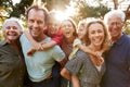 Outdoor Portrait Of Multi-Generation Family Walking In Countryside Against Flaring Sun Royalty Free Stock Photo