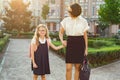 Outdoor portrait of parent and children on the way to school Royalty Free Stock Photo