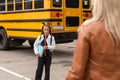 Outdoor portrait of a parent and children on the way to school Royalty Free Stock Photo