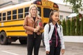 Outdoor portrait of a parent and children on the way to school Royalty Free Stock Photo