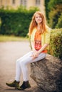 Outdoor portrait of pretty little girl with red hair Royalty Free Stock Photo