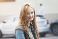 Outdoor portrait of pretty smiling red haired young girl Royalty Free Stock Photo