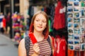 Outdoor portrait of pretty teenage girl with red dyed hair Royalty Free Stock Photo