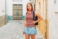 Outdoor portrait of pretty teenage girl with red dyed hair Royalty Free Stock Photo