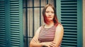 Outdoor portrait of pretty teenage girl with red dyed hair Royalty Free Stock Photo