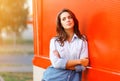 Outdoor portrait pretty woman against colorful wall