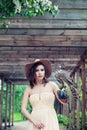 Outdoor portrait of pretty woman fashion model with hawk bird outdoors portrait Royalty Free Stock Photo