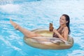 Outdoor portrait of pretty woman on vacation, wearing swimming suit, relaxing and having fun at pool party. Making funny face, Royalty Free Stock Photo