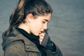 Outdoor portrait in profile of a thoughtful teenage girl Royalty Free Stock Photo