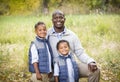 Outdoor Portrait of a Racially Diverse Father with his two sons Royalty Free Stock Photo