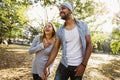 Portrait of romantic and happy mixed race young couple in park Royalty Free Stock Photo