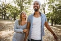 Pportrait of romantic and happy mixed race young couple in park Royalty Free Stock Photo