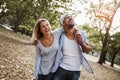 Portrait of romantic and happy mixed race young couple in park Royalty Free Stock Photo