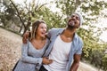 Portrait of romantic and happy mixed race young couple in park Royalty Free Stock Photo