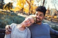 Outdoor portrait of romantic mixed race young couple