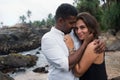 Outdoor portrait of romantic young couple in sandy beach. Royalty Free Stock Photo