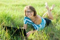 Outdoor portrait smiling middle-aged woman freelancer blogger traveler with laptop on nature Royalty Free Stock Photo