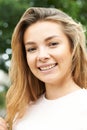 Outdoor Head And Shoulders Portrait Of Smiling Teenage Girl Royalty Free Stock Photo