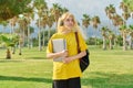 Outdoor portrait of teenage female student with laptop backpack. Royalty Free Stock Photo