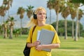 Outdoor portrait of teenage female student with laptop backpack. Royalty Free Stock Photo