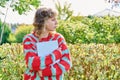 Teenage student girl with laptop in hands, looking in profile Royalty Free Stock Photo