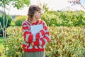 Teenage student girl with laptop in hands, looking in profile Royalty Free Stock Photo