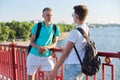 Outdoor portrait of two friends boys teenagers 15, 16 years old, talking laughing Royalty Free Stock Photo