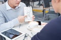 Outdoor portrait of two young entrepreneurs working at coffee sh Royalty Free Stock Photo