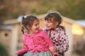 Outdoor portrait of two young happy children, girls - sisters - Royalty Free Stock Photo