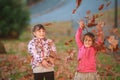 Outdoor portrait of two young happy children, girls - sisters - Royalty Free Stock Photo