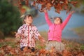 Outdoor portrait of two young happy children, girls - sisters - Royalty Free Stock Photo