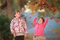 Outdoor portrait of two young happy children, girls - sisters - Royalty Free Stock Photo