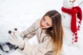 Outdoor portrait of winter girl in cold sunny winter weather in park. Beauty Winter Girl in frosty winter Park. Royalty Free Stock Photo