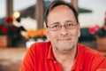 Outdoor portrait of 50 year old man wearing red polo shirt Royalty Free Stock Photo