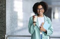 Outdoor portrait of young beautiful black woman employee Royalty Free Stock Photo