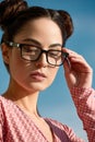 Outdoor portrait of a young beautiful confident woman posing on the street. Model wearing stylish glasses. Female Royalty Free Stock Photo