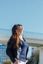 Outdoor portrait of a young beautiful confident woman posing on the street Royalty Free Stock Photo