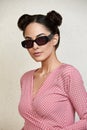 Outdoor portrait of a young beautiful confident woman posing on the street. Model wearing stylish sunglasses. Girl Royalty Free Stock Photo
