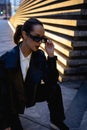 Outdoor portrait of a young beautiful confident woman posing on the street. Royalty Free Stock Photo