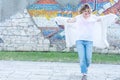 Young attractive woman with red lips in white casual clothes walking posing in the street Royalty Free Stock Photo