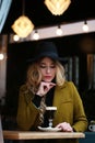 Outdoor portrait of a young beautiful fashionable lady wearing olive coat Royalty Free Stock Photo