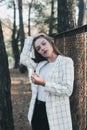 Outdoor Portrait of young beautiful fashionable woman wearing stylish white jacket. Model on the street. Women`s fashion concept Royalty Free Stock Photo