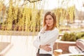 Outdoor portrait of young beautiful woman posing on street in sunny day. Female fashion. City lifestyle. Royalty Free Stock Photo