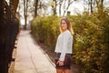 Outdoor portrait of young beautiful woman posing on street. in sunny day. Female fashion. City lifestyle Royalty Free Stock Photo