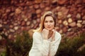 Outdoor portrait of young beautiful woman posing on street. in sunny day. Female fashion. City lifestyle. Royalty Free Stock Photo