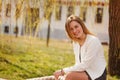 Outdoor portrait of young beautiful woman posing on street. in sunny day. Female fashion. City lifestyle. Royalty Free Stock Photo