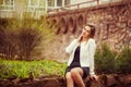 Outdoor portrait of young beautiful woman posing on street. in sunny day. Female fashion. City lifestyle. Royalty Free Stock Photo