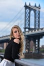 Outdoor portrait of young blond sensual woman posing in elegant clothes on the pier. Royalty Free Stock Photo